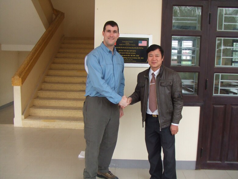 Then Capt. Daniel J. Fox with the U.S. Army Corps of Engineers, Alaska District, poses with the principal at Kien Quoc Primary School in Vietnam after a one-year warranty inspection in 2011, a year after the school was completed in July 2010. Recently promoted to lieutenant colonel, Fox now serves as the Deputy District Commander of the U.S. Army Corps of Engineers, Europe District which similarly supports humanitarian assistance projects in Europe and in Africa. (Courtesy Photo)