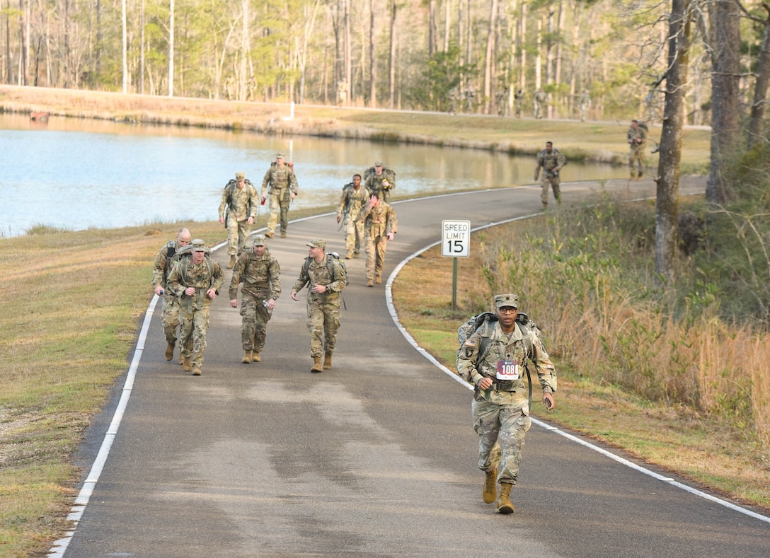 U.S. Army Engineer Research and Development Center’s Lt. Col. Christian Patterson walks with a 25-pound ruck sack during the 18.6-mile Norwegian Foot March at Camp Shelby Joint Forces Training Center, near Hattiesburg, Miss., March 6, 2021. Patterson and five additional ERDC Soldiers, including ERDC Commander Col. Teresa Schlosser, Maj. Earl Dean, British Liaison Maj. Peter Mackintosh, Capt. Patrick Border and Capt. Jeremiah Paterson, completed the event. (Photo by 2nd Lt. Michael Needham, U.S. Army National Guard)