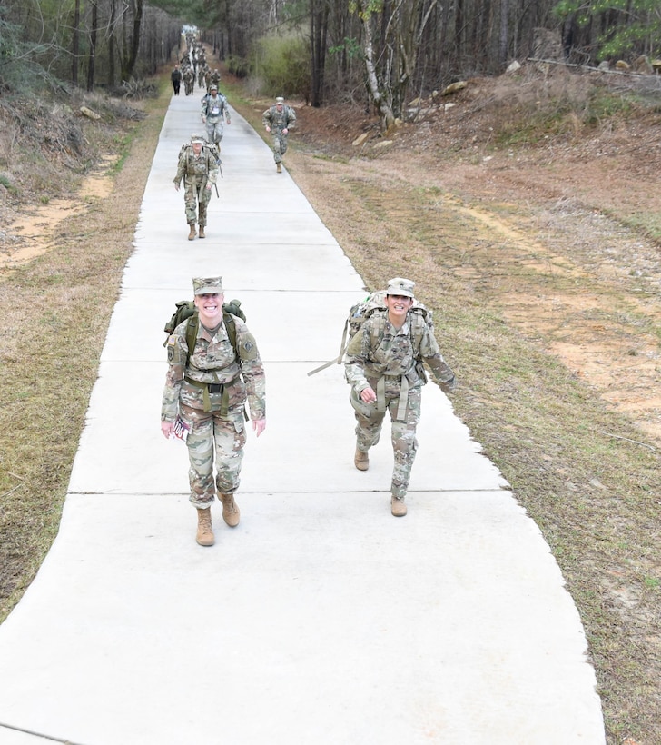 U.S. Army Engineer Research and Development Center Commander Col. Teresa Schlosser walks with a troop during the 18.6-mile Norwegian Foot March at Camp Shelby Joint Forces Training Center, near Hattiesburg, Miss., March 6, 2021. Schlosser and five additional ERDC Soldiers, including Lt. Col. Christian Patterson, Maj. Earl Dean, British Liaison Maj. Peter Mackintosh, Capt. Patrick Border and Capt. Jeremiah Paterson, completed the event. (Photo by 2nd Lt. Michael Needham, U.S. Army National Guard)