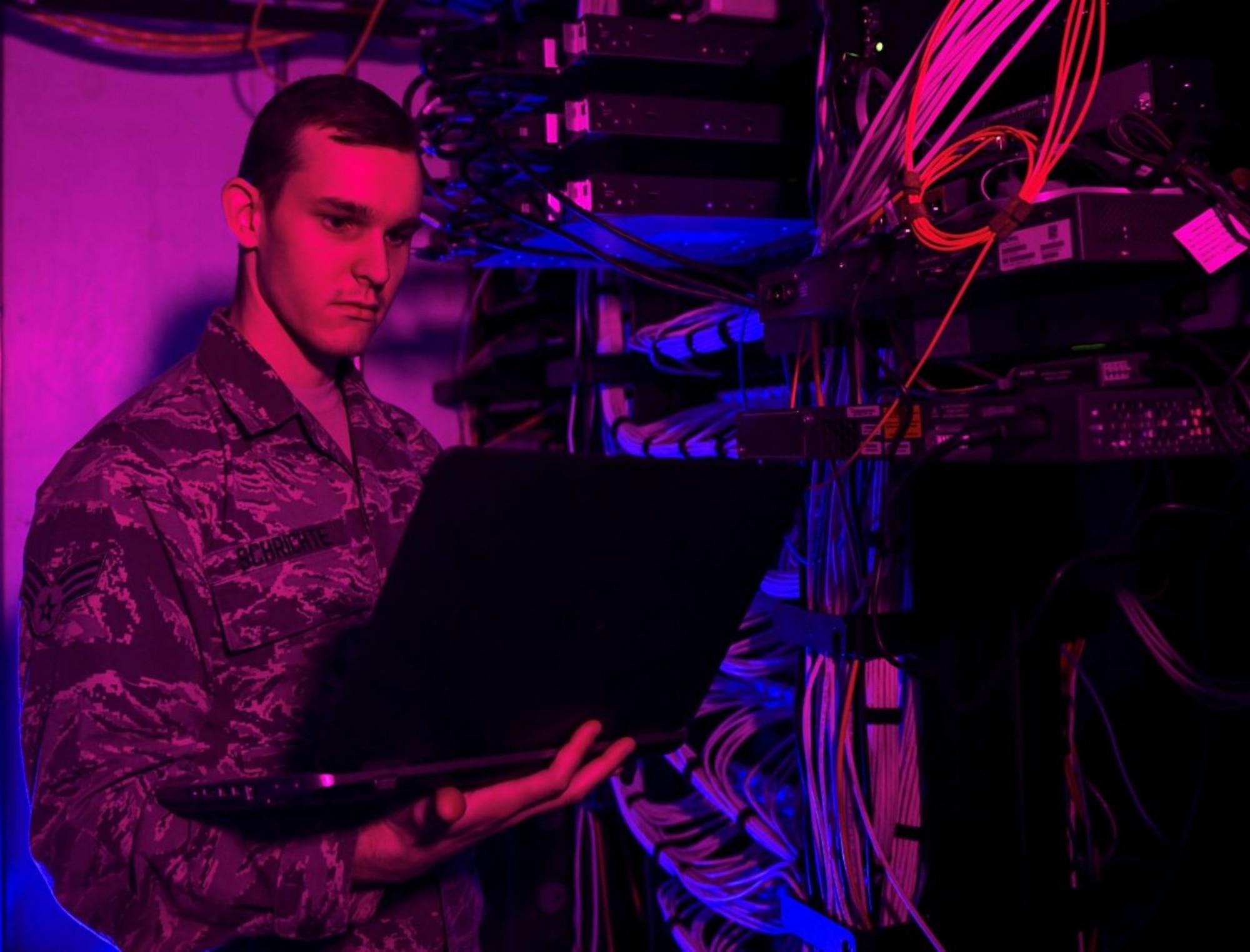 Senior Airman Alexander Schrichte, 460th Space Communications Squadron client systems technician, performs routine technical checks on network servers in November 2018 at Buckley Air Force Base, Colorado. Buckley is one of eight Air and Space Force locations currently receiving EITaaS end user service upgrades that provide Airmen and Guardians a consolidated service desk and catalog, faster login times, and higher functioning devices (U.S. Air Force photo by Airman 1st Class Michael D. Mathews)