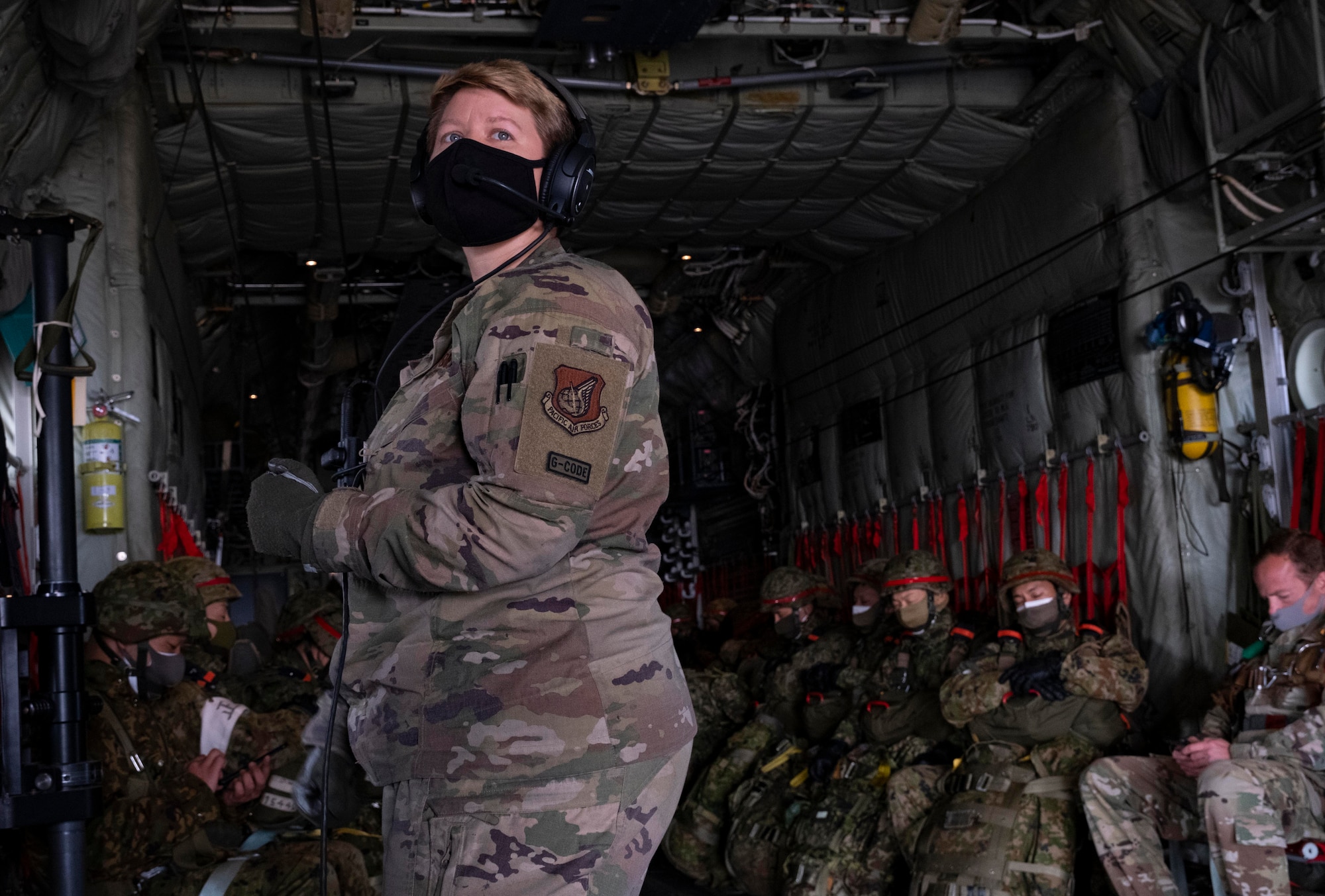 Staff Sgt. Lauren Shaw, 36th Airlift Squadron loadmaster, prepares for a static-line jump during exercise Airborne 21 near Camp Fuji, Japan, March 9, 2021