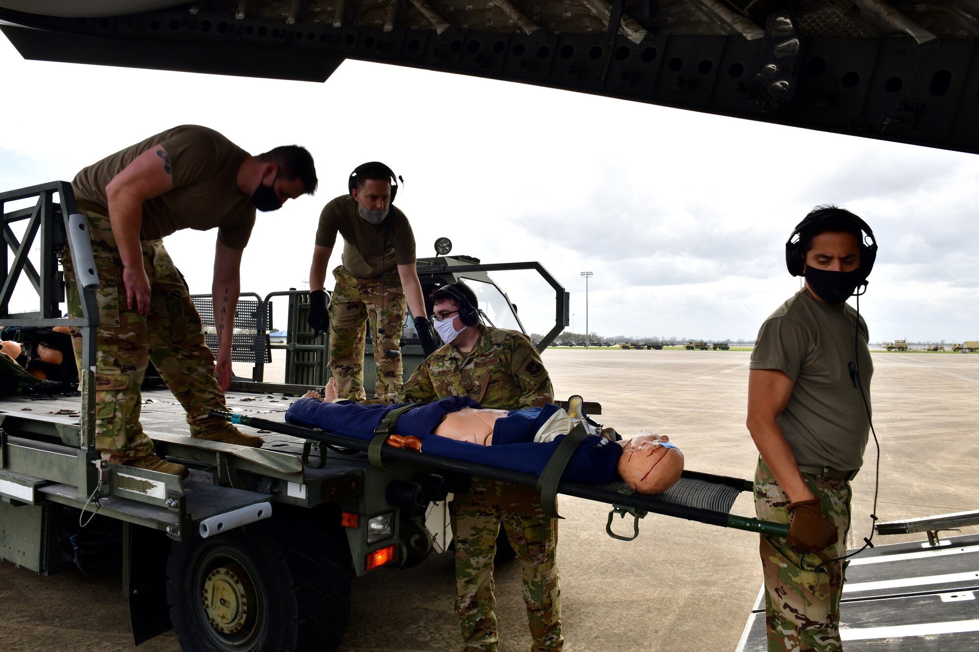 Airmen transload simulated patients onto a C-17
