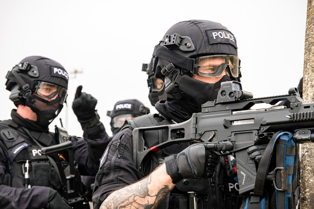 Policemen from the Northamptonshire Police Department, conduct a field training exercise at RAF Croughton, England, Mar. 3, 2021. The NHPD utilized the 422d Security Forces Squadron training complex to help strengthen their tactics and techniques. Events like this help strengthen the local partnership between the 422d SFS and the NHPD. (U.S. Air Force photo by Senior Airman Eugene Oliver)
