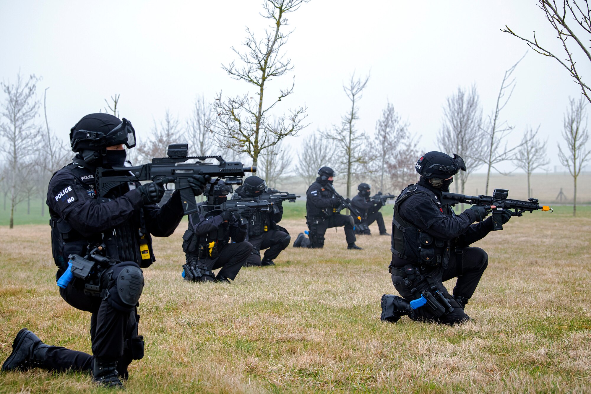 Policemen from the Northamptonshire Police Department conduct a field training exercise at RAF Croughton, England, Mar. 3, 2021. The NHPD utilized the 422d Security Forces Squadron training complex to help strengthen their tactics and techniques. Events like this help strengthen the local partnership between the 422d SFS and the NHPD. (U.S. Air Force photo by Senior Airman Eugene Oliver)