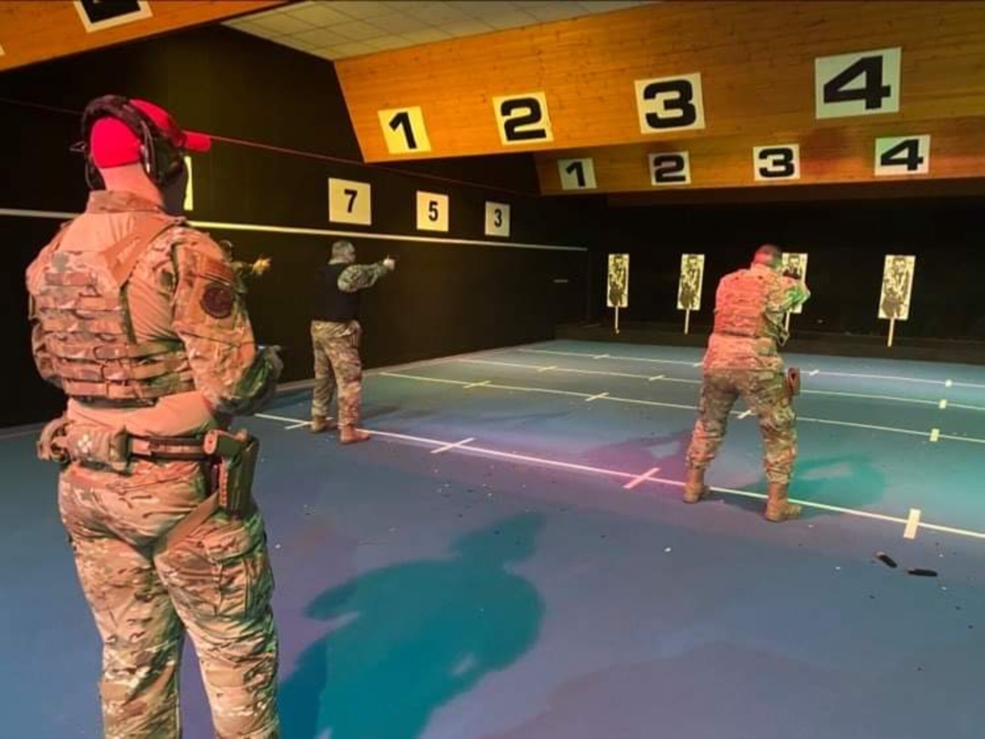 Airmen from the 422d Security Forces Squadron conduct live fire training at the Northamptonshire police department, England, Mar. 5, 2021. Airmen from the 422d SFS utilized the NHPD firing range to help strengthen their tactics and techniques. Events like this help strengthen the local partnership between the 422d SFS and the NHPD. (U.S. Air Force photo by 1st Lt. George Marte)