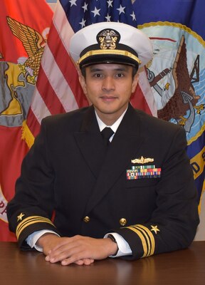 Studio portrait of Cmdr. Mark K. Poblete