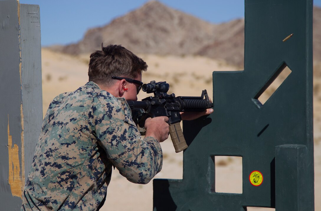 U.S. Marine Corps Sgt. Thomas Dines, motor vehicle operator, Exercise Support Division, Marine Air Ground Task Force Training Command, fires an M16A4 service rifle at targets in the Marine Corps Marksmanship Competition West at Marine Corps Air Ground Combat Center, Twentynine Palms, California, March 4, 2021. The Marine Corps Marksmanship Competition West is one of four marksmanship competitions in the Marine Corps that gathers Marines to improve and test their skills while competing. (U.S. Marine Corps photo by Lance Cpl. Jacquilyn Davis)