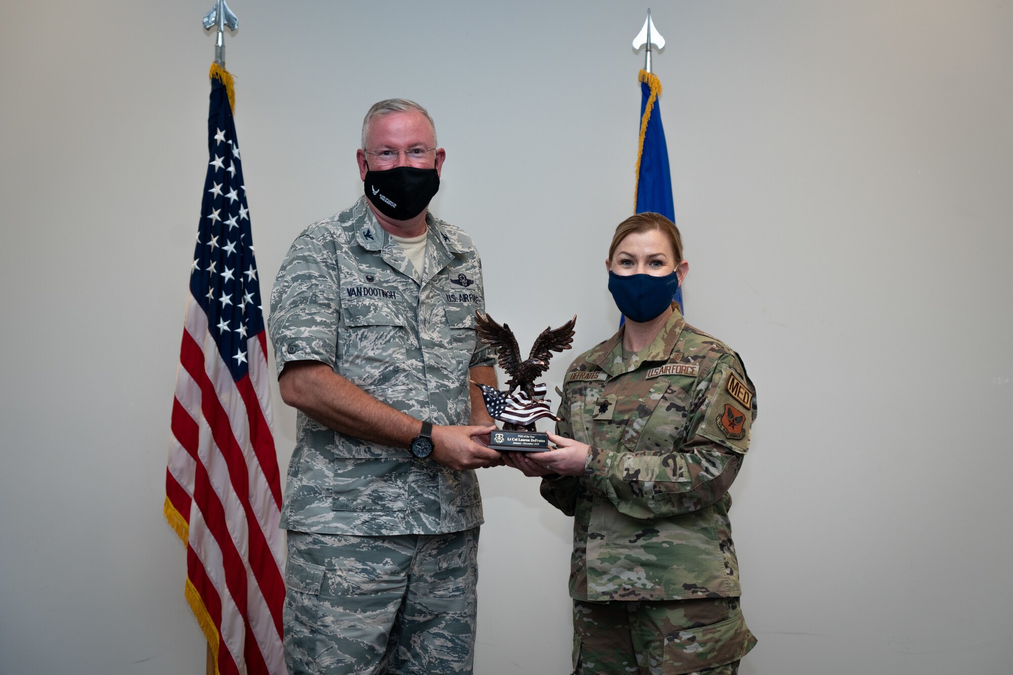Lt. Col. Lauren DeFrates with the 403rd Wing receives the Field Grade Officer of the Year Award during a commander’s call at Keesler Air Force Base, Biloxi Mississippi, March 13, 2021 . Top performers from the wing were recognized for their outstanding work throughout fourth quarter of 2020. (U.S. Air Force photo by Staff Sgt. Shelton Sherrill)