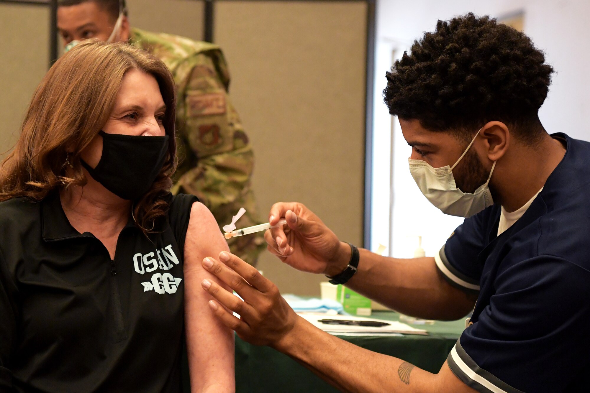 Osan Elementary and Middle High School teachers receive the COVID-19 vaccine at Osan Air Base, Republic of Korea, March 12, 2021. While voluntary, the members of Osan are encouraged to obtain the vaccine to protect the base and help reduce the strain on the healthcare systems. (U.S. Air Force photo by Senior Airman Noah Sudolcan)