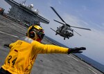 Aviation Boatswain’s Mate (Aircraft Handling) 3rd Class Kieara Dexter signals an Italian EH101 Merlin helicopter from the Italian Navy to take off from on board the Expeditionary Sea Base USS Hershel “Woody” Williams (ESB 4) in the Atlantic Ocean, Mar. 11, 2021. Hershel “Woody” Williams is operating in U.S. Sixth Fleet to conduct interoperability training and build strategic partnerships with their African partners.
