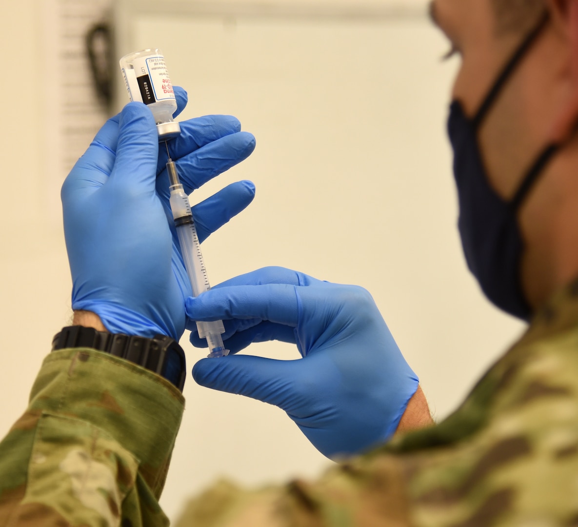 A Virginia National Guard Soldier prepares a COVID-19 vaccination March 10, 2021, at Fort Pickett, Virginia. The Virginia National Guard is reconfiguring the task force currently conducting COVID-19 testing and mask fit training to create mobile vaccination teams to provide additional capacity for the statewide vaccination program.