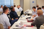 Personnel receive mentoring at the Association for Naval Officer’s (ANSO) Western Region Symposium at Sector Houston-Galveston, in Houston, March 2, 2020. Commissioned and enlisted members from the U.S. Coast Guard and U.S. Navy attended to learn, share, and discuss topics on diversity, retention, and leadership within the maritime services as well as receive mentoring and one-on-one sessions with members of ANSO's Board of Directors. (U.S. Coast Guard photo by Petty Officer 3rd Class Paige Hause)