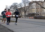 DLA Disposition Services Acting Director Army Col. Franyate Taylor, front left, and Stacey Pilling, front right, lead their colleagues Doug Mulvaney, left rear, Andrew VanKoevering as they head out from the Hart-Dole-Inouye Federal Center to run their 3.14 miles March 12 in observance of Pi Day.