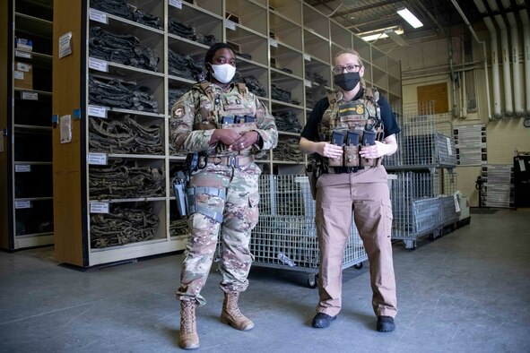 two police officers stand next to each other.