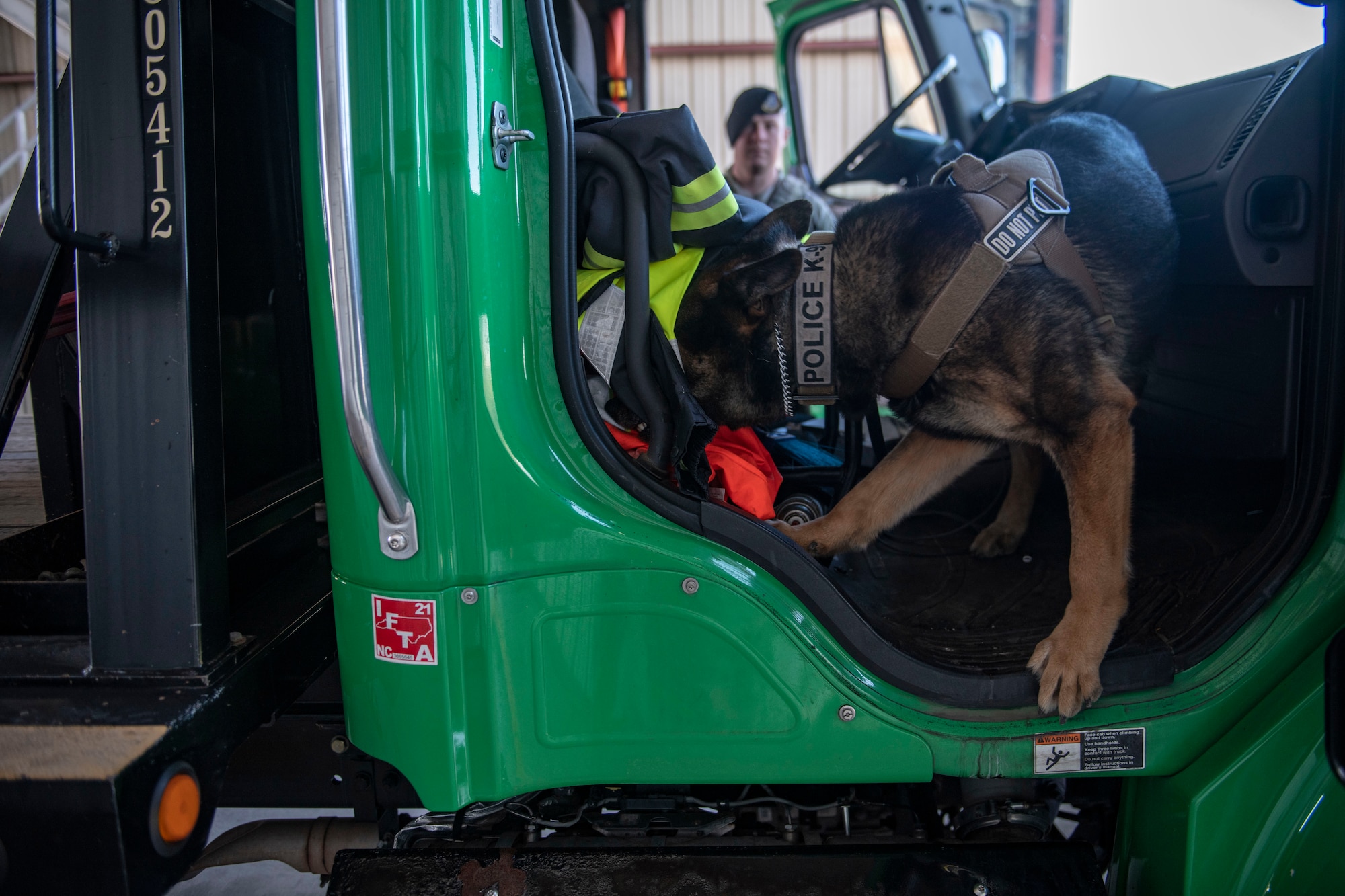 Staff Sgt. Jason Herrier, 9th Security Forces Squadron (SFS) military working dog (MWD) handler observes Bady 2, 9th SFS MWD as he finds a training aide placed in a vehicle on Beale Air Force Base.
