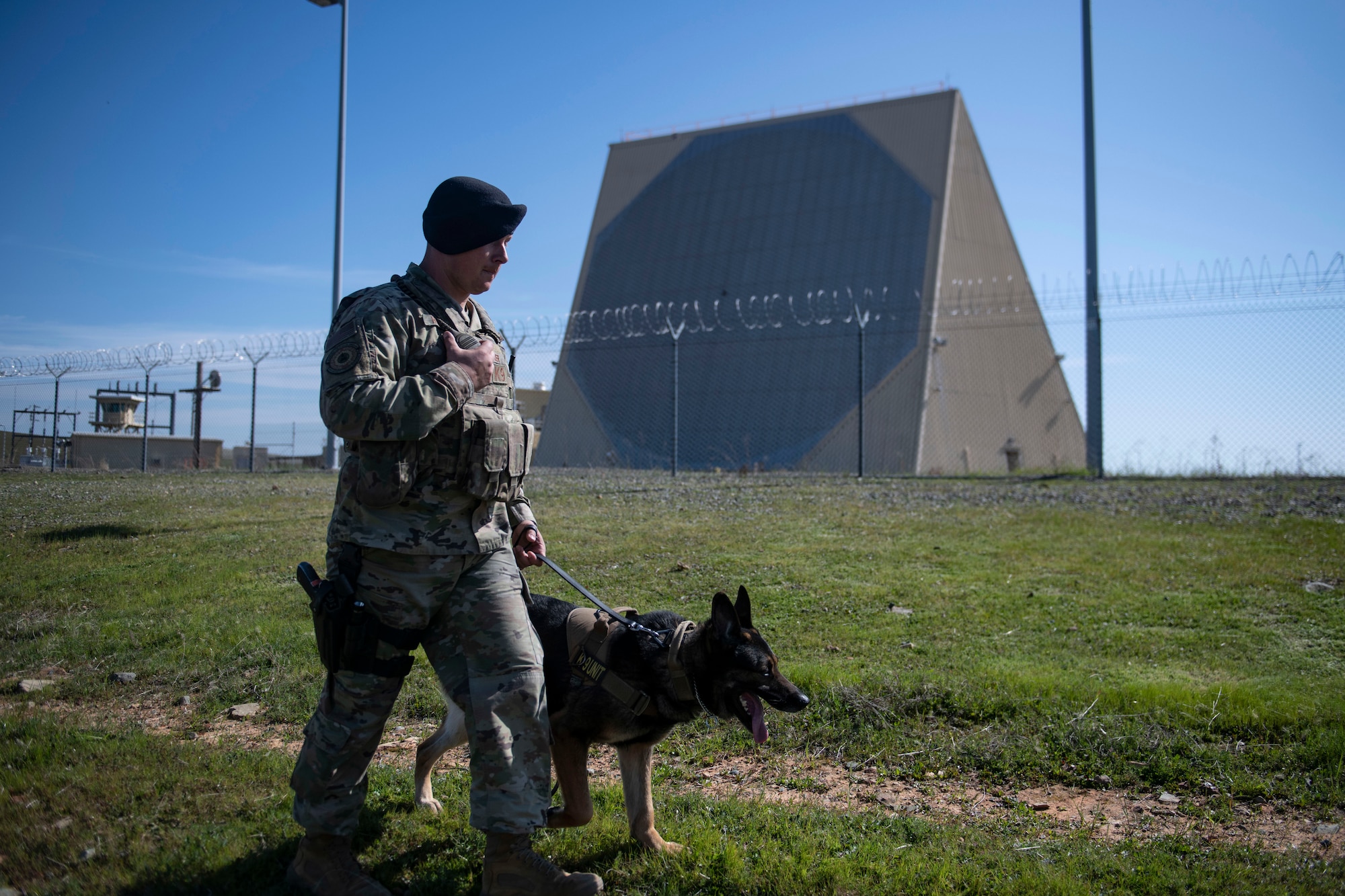 Staff Sgt. Jason Herrier, 9th Security Forces Squadron (SFS) military working dog (MWD) handler and Bady 2, 9th SFS MWD patrol around the 7th Space Warning Squadron on Beale Air Force Base.