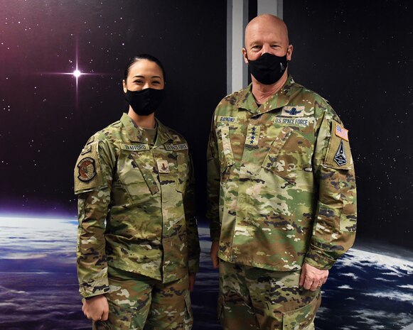 U.S. Space Force Gen. John W. “Jay” Raymond, Chief of Space Operations, right, and U.S. Space Force 2nd Lt. Miriam Trafford, 7th Space Warning Squadron crew commander, left, pose for a photo March 11, 2021, at Beale Air Force Base, California. (U.S. Air Force photo by Airman 1st Class Luis A. Ruiz-Vazquez)