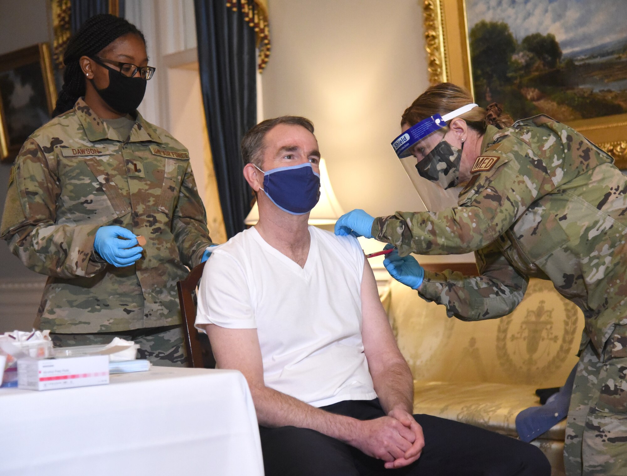 Virginia National Guard personnel administer the COVID-19 vaccine to Virginia Gov. Ralph Northam and Virginia First Lady Pamela Northam March 15, 2021, at the Executive Mansion in Richmond, Virginia.