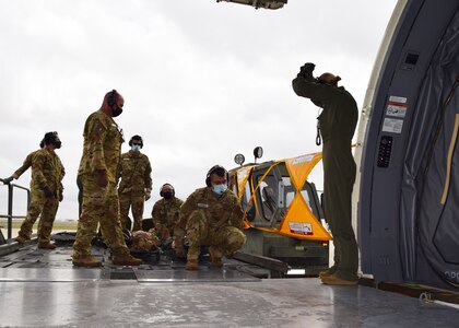 Reserve Citizen Airmen with the 433rd Aeromedical Evacuation Squadron prepare to carry a simulated patient on a litter into a KC-46A Pegasus during initial qualification training at Joint Base San Antonio-Lackland, Texas, March 9, 2021. When not serving in a military capacity, many of these personnel also work in the civilian healthcare industry. (U.S. Air Force photo by Tech. Sgt. Iram Carmona)