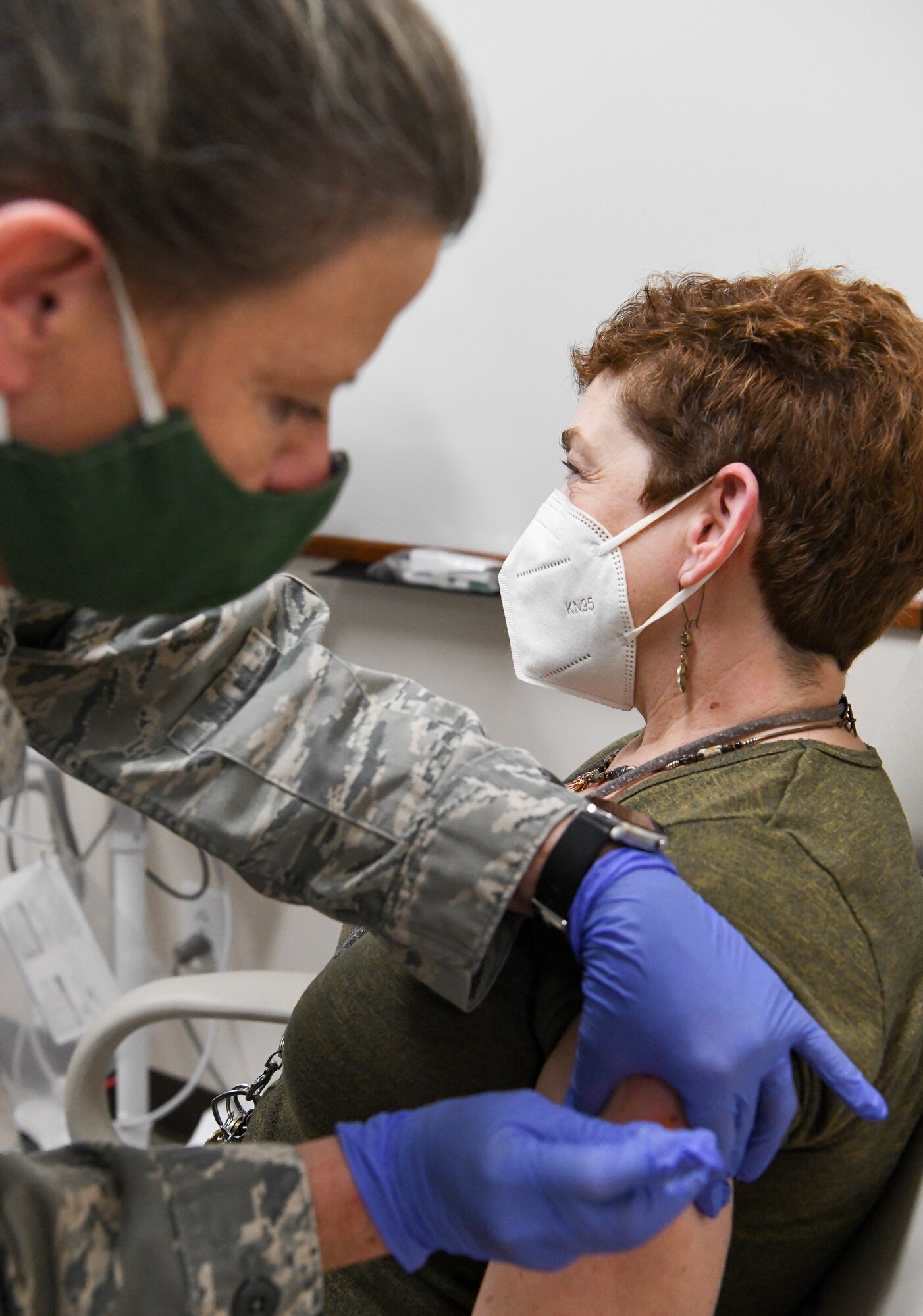 Master Sgt. Marti Stanley with the Tennessee Air National Guard administers a COVID-19 vaccine to Angelia Garrard, an Arnold Engineering Development Complex team member, at Arnold Air Force Base, Tenn., Feb. 23, 2021, at the Medical Aid Station on base. (U.S. Air Force photo by Jill Pickett)