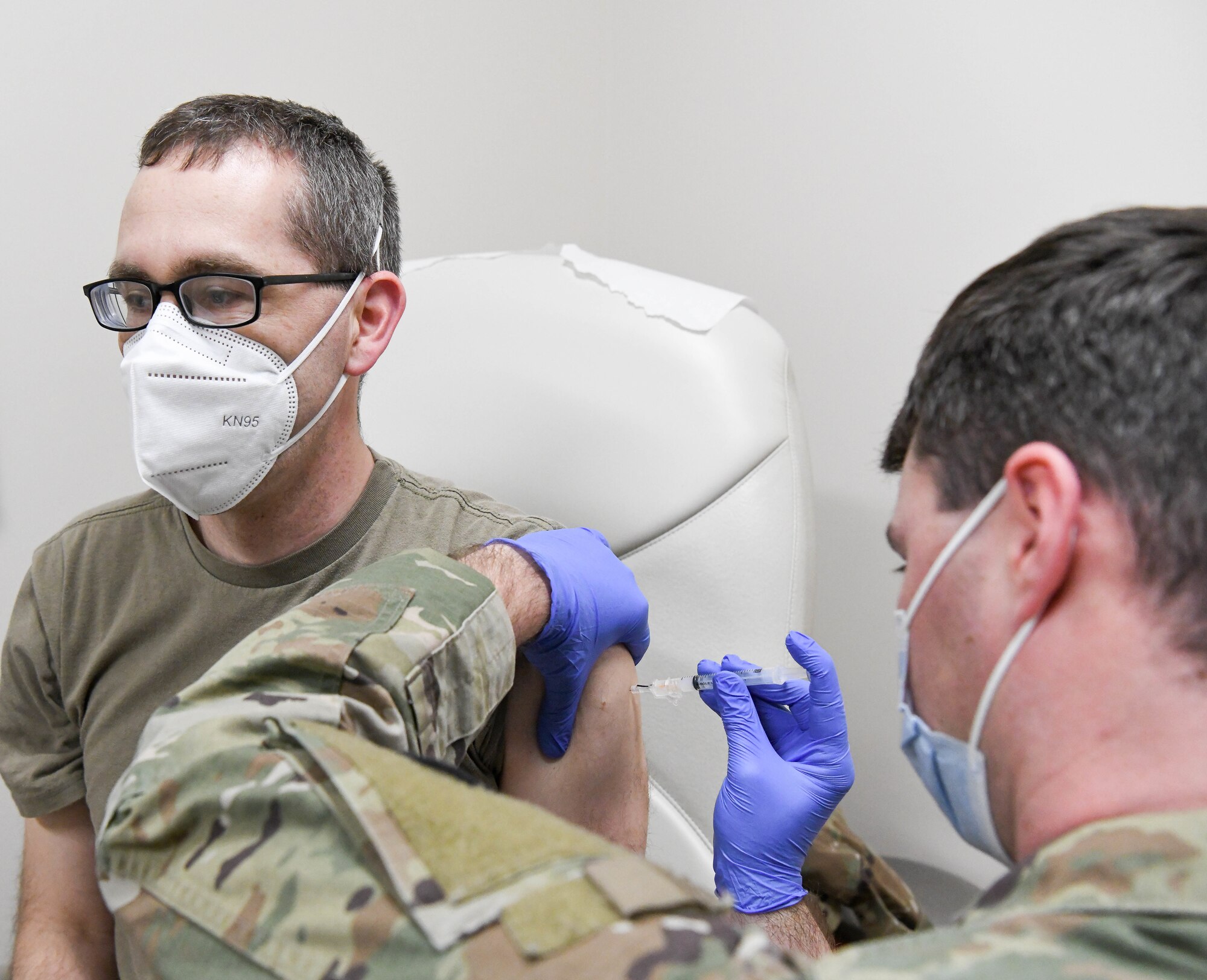 Sgt. Dillon Henderson with the Tennessee Army National Guard administers a COVID-19 vaccine to Maj. Wesly Anderson, an Arnold Engineering Development Complex team member, at Arnold Air Force Base, Tenn., Feb. 23, 2021, at the Medical Aid Station on base. (U.S. Air Force photo by Jill Pickett)