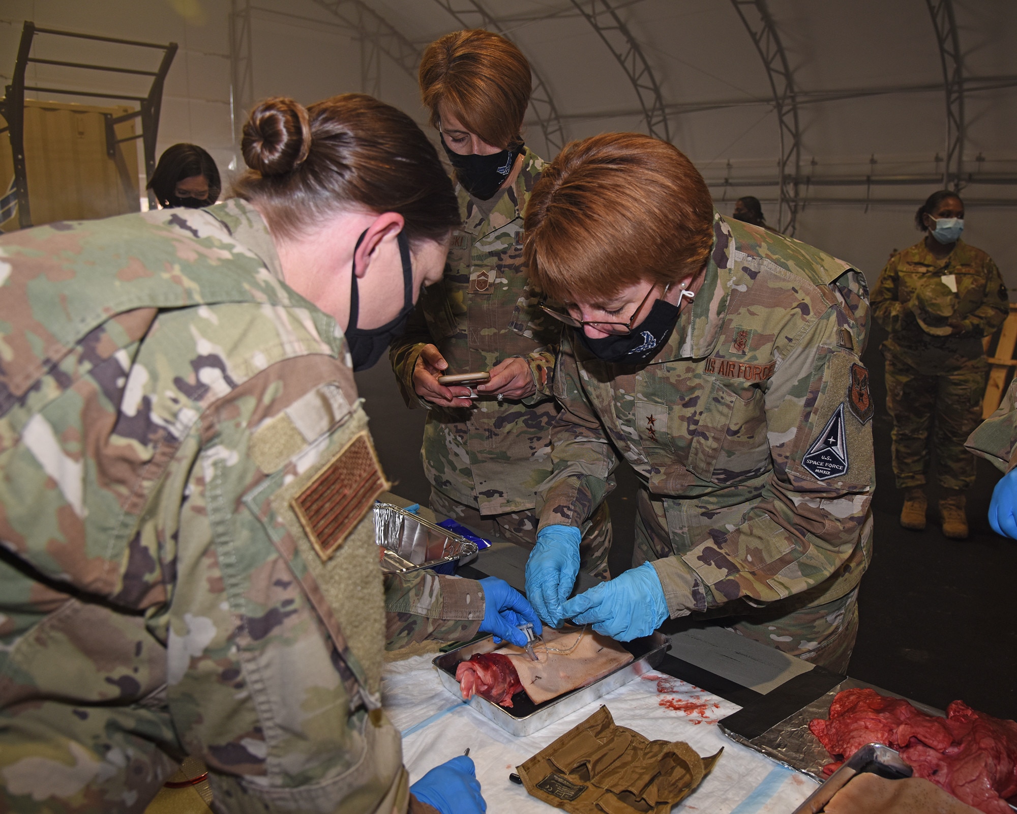 Lt. Gen. Dorothy Hogg, U.S. Air Force and Space Force surgeon general, experiences reviews the training given in the Tactical Combat Casualty Care All Combatants course Mar. 12, 2021, provided by Columbus Air Force Base, Miss. The course provides medics with life-saving skills in addition to tactical field care, tactical evacuation care and essential need-to-know capabilities to save lives while undergoing hostile combat situations. (Air Force photo by Elizabeth Owens)