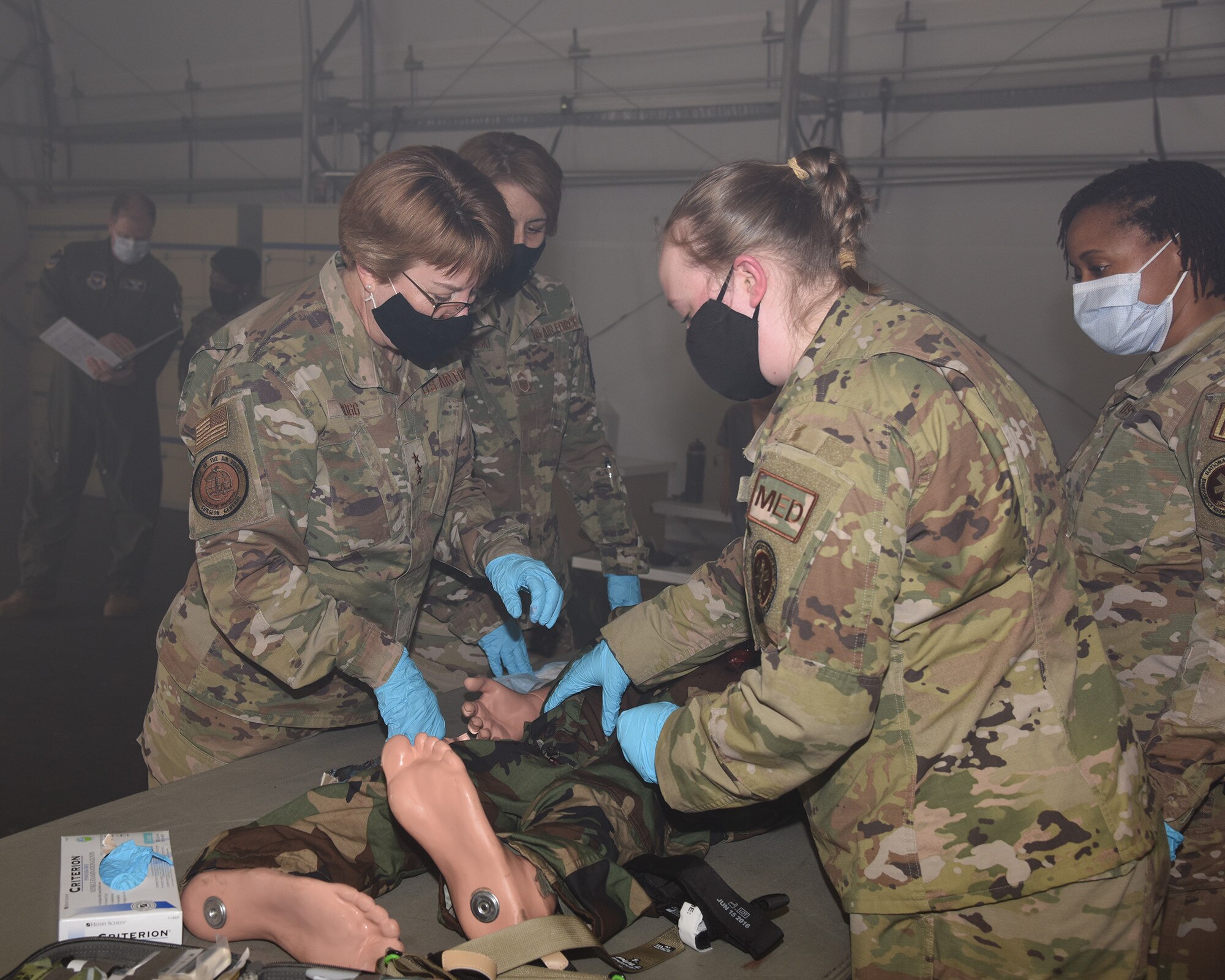 Lt. Gen. Dorothy Hogg, U.S. Air Force and Space Force surgeon general, looks over the augmented mannequin used in the Tactical Combat Casualty Care All Combatants course Mar. 12, 2021, provided by Columbus Air Force Base, Miss. With readiness being the number one priority of Hogg and a priority across the DoD, Columbus AFB 14th Medical Group is making sure the Airmen are getting the proper tactical medical training. (Air Force photo by Elizabeth Owens)