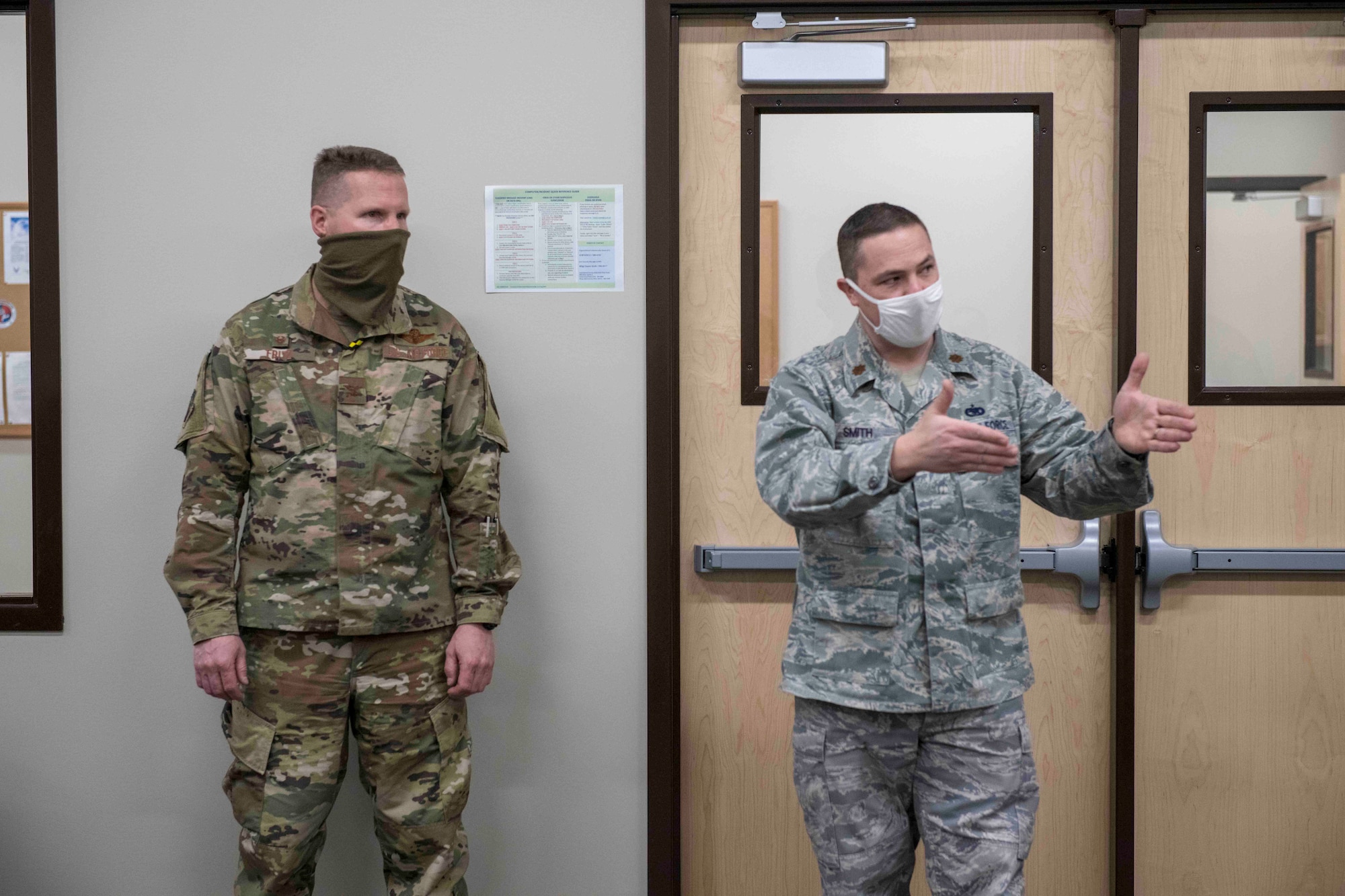 Maj. Kregg Smith (right), operations officer in the 419th Logistics Readiness Squadron, describes how the newly created deployment readiness cell will streamline pre-deployment and post-deployment processes for Airmen Mar. 6, 2021, at Hill Air Force Base, Utah.