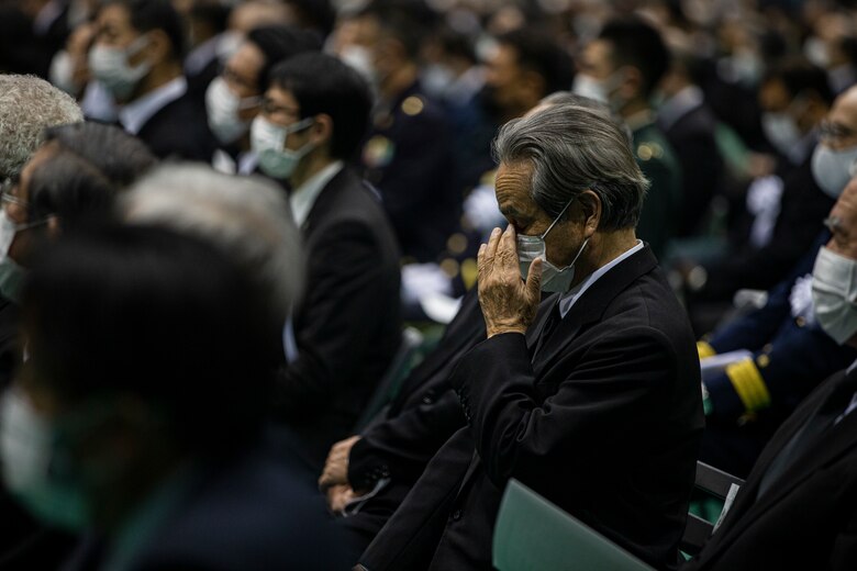 U.S. Marine Corps Brig. Gen. William Bowers, Marine Corps Installations Pacific commanding general, observes the 10 year anniversary ceremony of the disaster in Kesennuma, Japan, March 11, 2021. U.S. service members, survivors of the 2011 Great East Japan earthquake and tsunami and Japanese officials stood side-by-side in honoring the 10 year anniversary. The U.S. response, Operation Tomodachi, would become the largest Japan-U.S. bilateral operation, involving nearly 25,000 U.S. service members that assisted with aid efforts across the affected areas of Japan. (U.S. Marine Corps photo by Lance Cpl. Alex Fairchild)