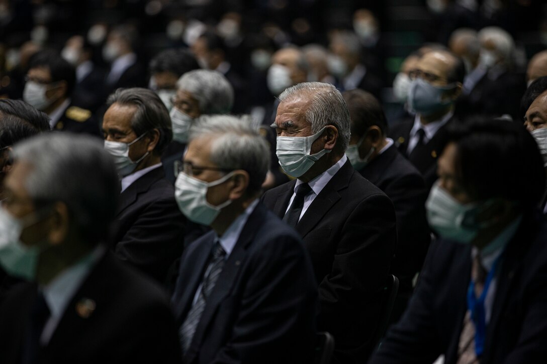 A survivor of the 2011 Great East Japan earthquake and tsunami expresses emotion during the 10 year anniversary ceremony of the disaster in Kesennuma, Japan, March 11, 2021. U.S. service members, survivors of the 2011 Great East Japan earthquake and tsunami and Japanese officials stood side-by-side in honoring the 10 year anniversary of the disaster. The U.S. response, Operation Tomodachi, would become the largest Japan-U.S. bilateral operation, involving nearly 25,000 U.S. service members that assisted with aid efforts across the affected areas of Japan. (U.S. Marine Corps photo by Lance Cpl. Alex Fairchild)