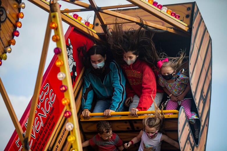 U.S. service members and their families participate in a pirate ship ride during the 2021 Hansen Festival on Camp Hansen, Okinawa, Japan, March 13, 2021. The festival is hosted annually to encourage camaraderie within the U.S. military community through an assortment of food, fun-filled activities and live performances. (U.S. Marine Corps photo by Lance Cpl. Alex Fairchild)