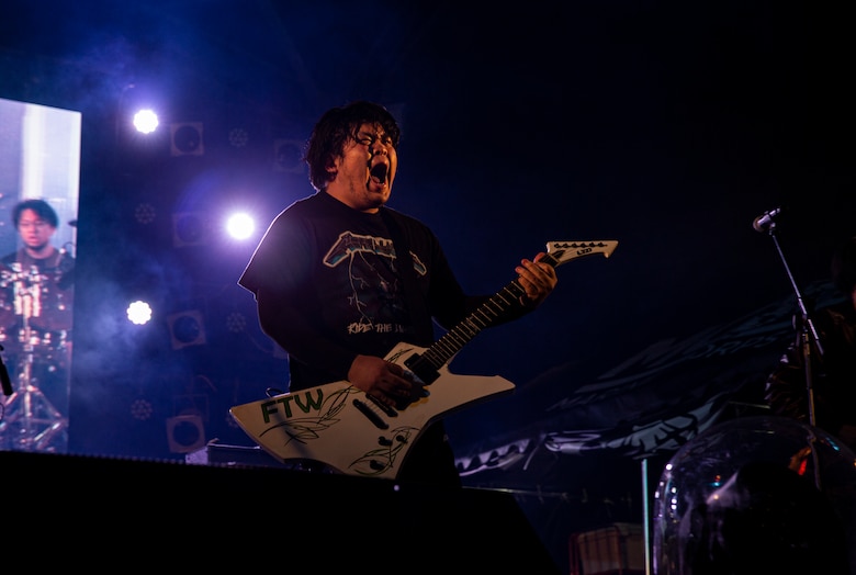 Shimabukuro Riki, the rhythm guitarist and lead singer with Mattalica, a Metallica tribute band, performs during the 2021 Hansen Festival on Camp Hansen, Okinawa, Japan, March 13, 2021. The festival is hosted annually to encourage camaraderie within the U.S. military community through an assortment of food, fun-filled activities and live performances. (U.S. Marine Corps photo by Lance Cpl. Alex Fairchild)