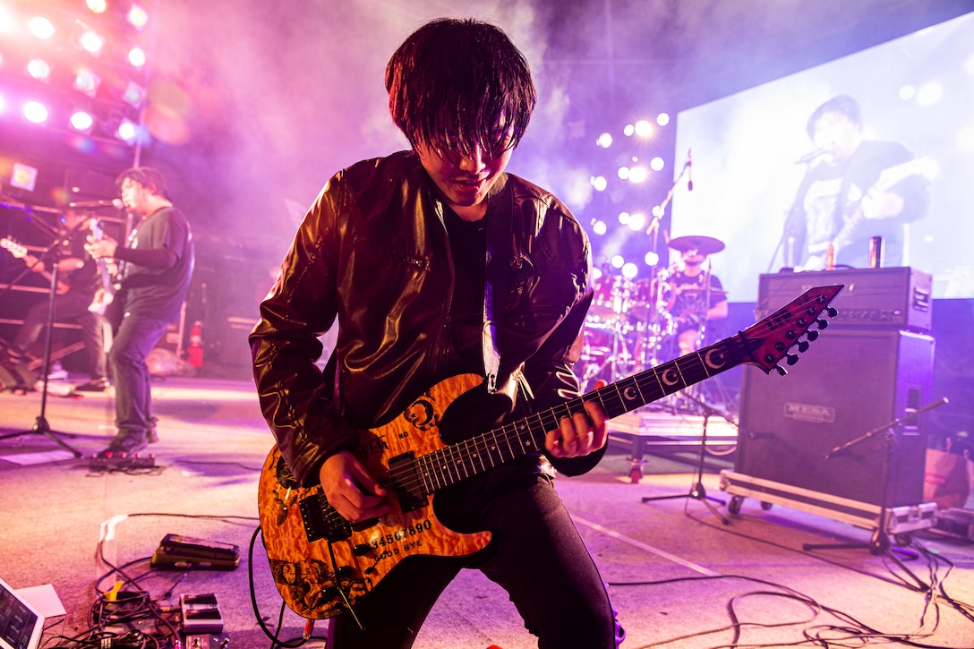 Kata Tanaka, the lead guitarist with Mattalica, a Metallica tribute band, performs during the 2021 Hansen Festival on Camp Hansen, Okinawa, Japan, March 13, 2021. The festival is hosted annually to encourage camaraderie within the U.S. military community through an assortment of food, fun-filled activities and live performances. (U.S. Marine Corps photo by Lance Cpl. Alex Fairchild)