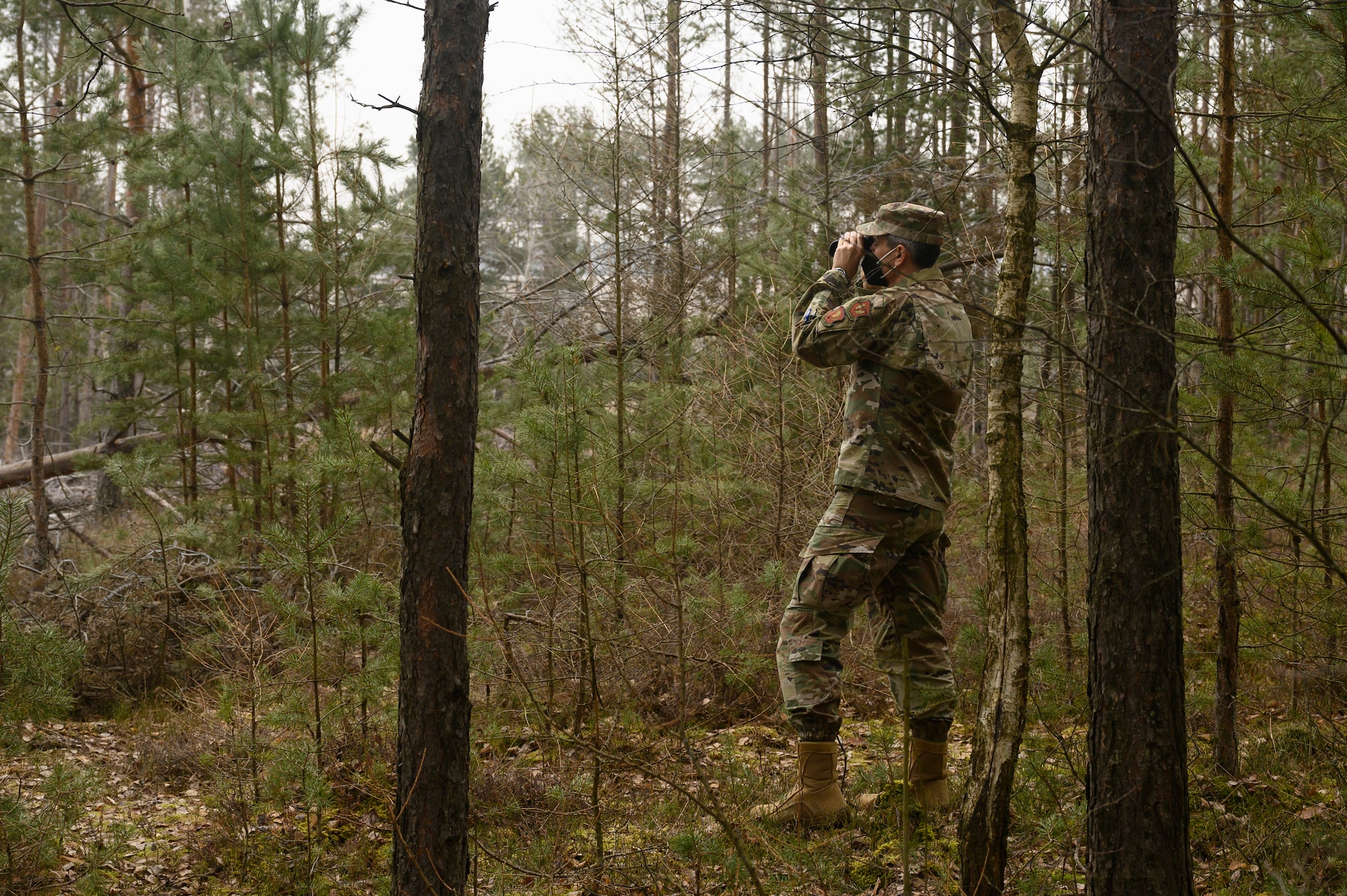 An Airman surveys the training area.