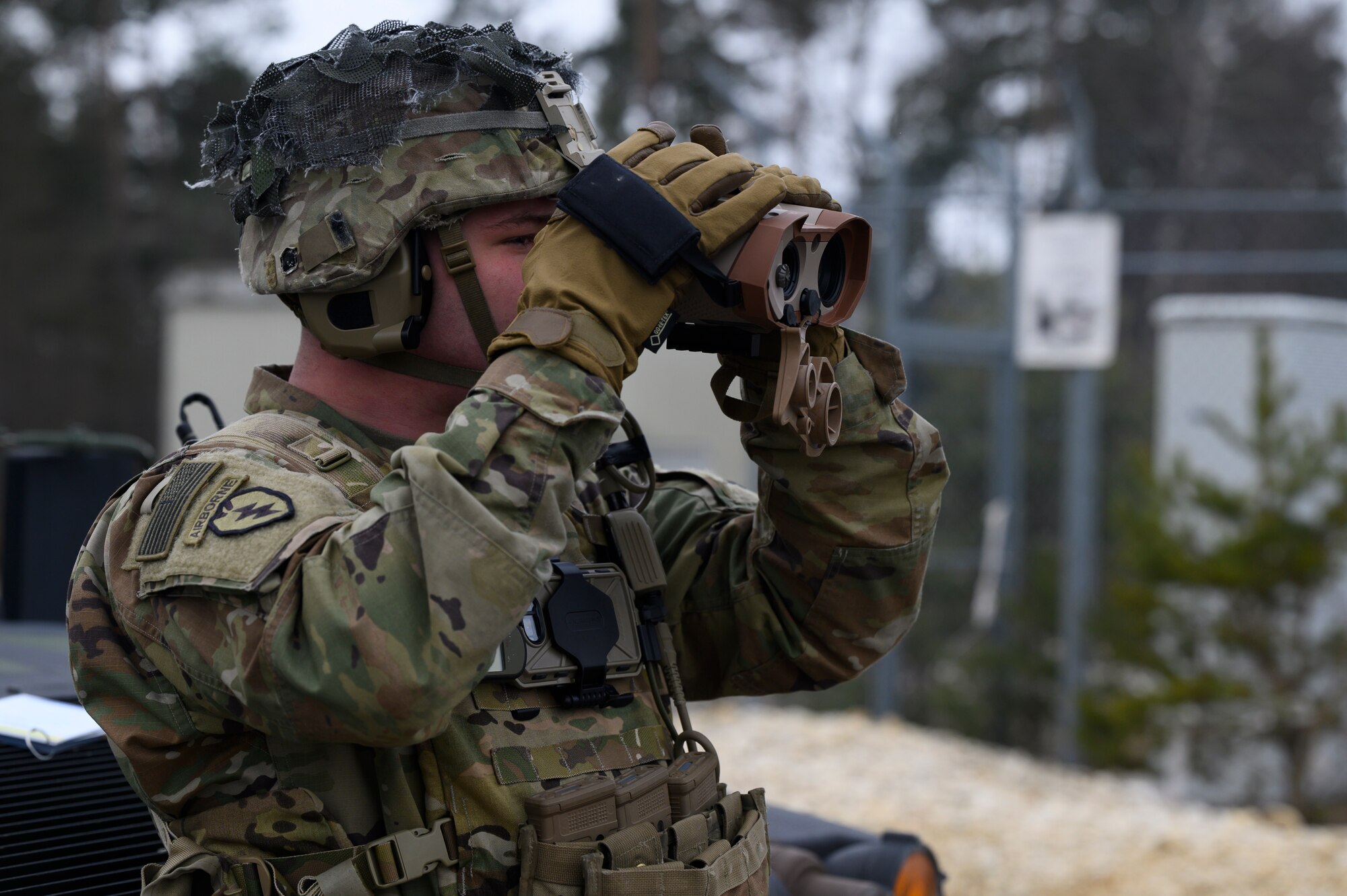 A soldier surveys the training area.