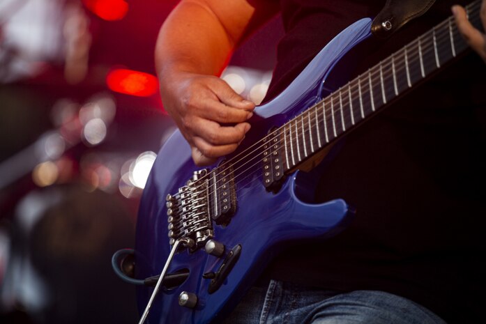Jun Oshiro, the guitarist with the Koza City Rockers, a rock and roll tribute band, performs during the 2021 Hansen Festival on Camp Hansen, Okinawa, Japan, March 13, 2021.