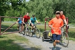 A Tom's Run team running on the trail.