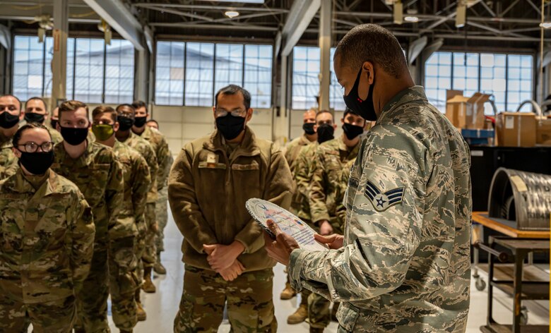 A photo of an Airman receiving an award.