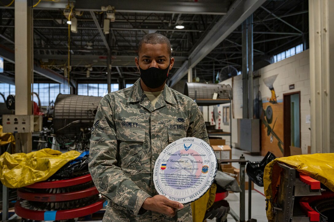 A photo of an Airman with an award.