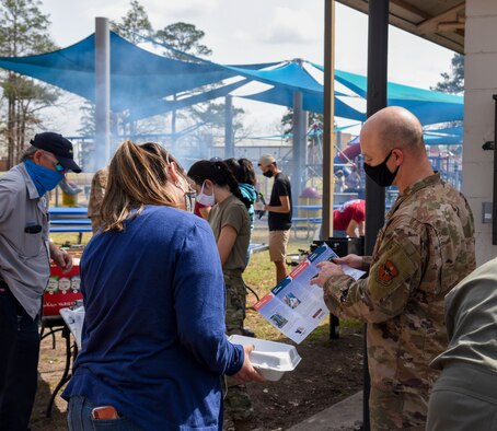 Two members of Columbus Air Force Base discuss the Air Force Assistance Fund on March 12, 2021, at Columbus Air Force Base, Miss. Information about the AFAF can be found at afassistancefund.org. (U.S. Air Force photo by Sharon Ybarra)