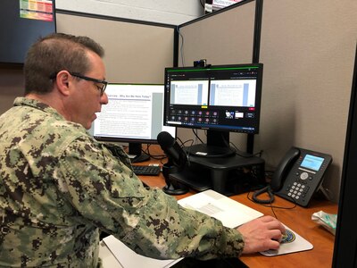 Rear Adm. Joseph DiGuardo speaks with Navy Expeditionary Combat Command (NECC) Sailors and civilians during a Secretary of Defense directed stand down to address extremism in the Navy.