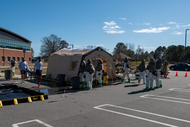 4th Medical Group Airmen participate in chemical decon training.