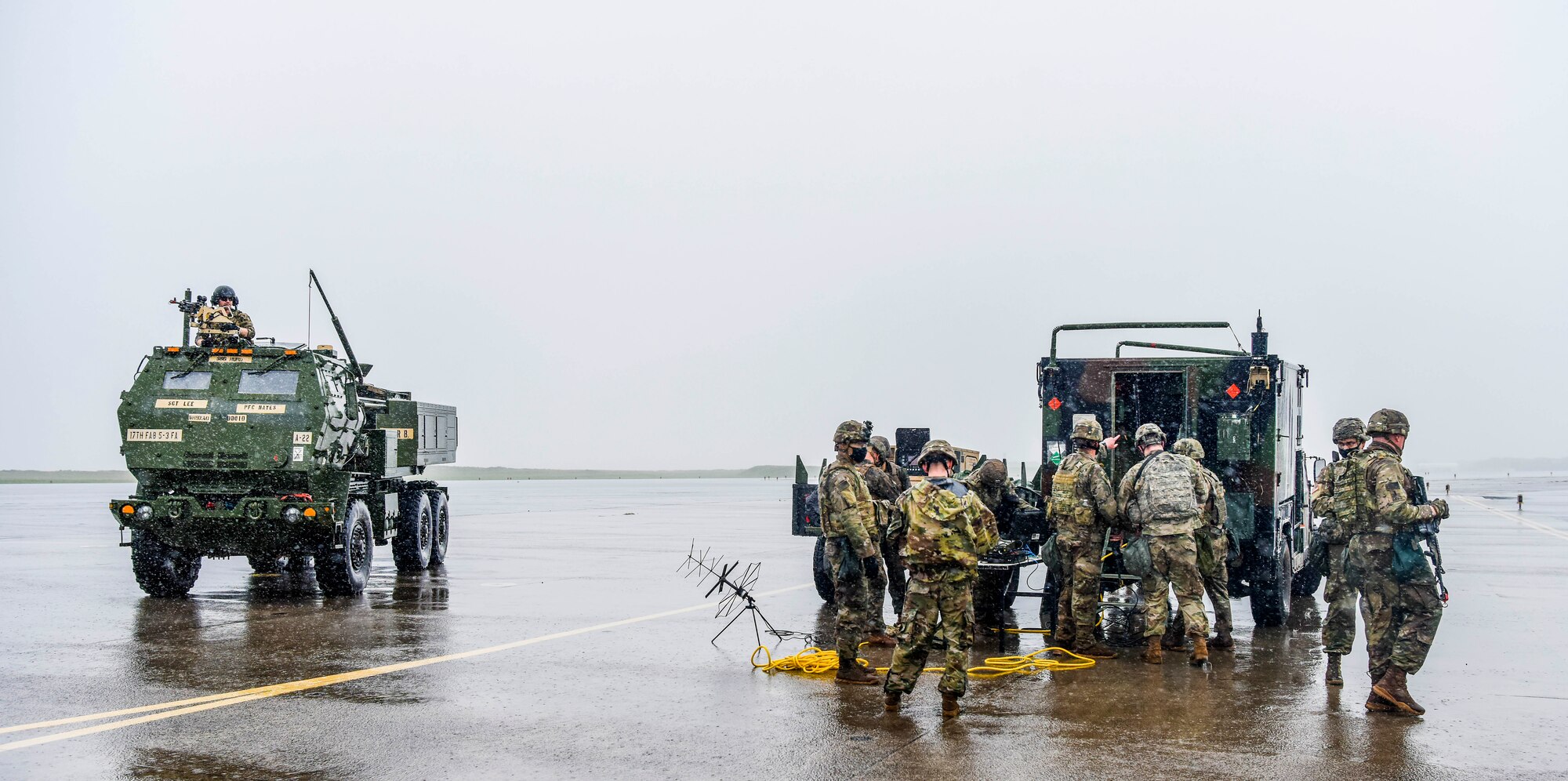 Soldiers with Alpha Battery, 5th Battalion, 3rd Field Artillery Regiment, 17th Field Artillery Brigade assigned to Joint Base Lewis-McChord participates in Exercise TROPIC FURY at Pacific Missile Range Facility Barking Sands, Hawaii, March 12, 2021. FA17 trained soldiers to fire the High Mobility Artillery Rocket System that can achieve a range of 70-plus kilometers. 

 (U.S. Air Force photo by Tech. Sgt. Anthony Nelson Jr.)