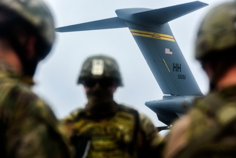 Soldiers with Alpha Battery, 5th Battalion, 3rd Field Artillery Regiment, 17th Field Artillery Brigade assigned to Joint Base Lewis-McChord participates in Exercise TROPIC FURY at Pacific Missile Range Facility Barking Sands, Hawaii, March 12, 2021. FA17 trained soldiers to fire the High Mobility Artillery Rocket System that can achieve a range of 70-plus kilometers. 

 (U.S. Air Force photo by Tech. Sgt. Anthony Nelson Jr.)