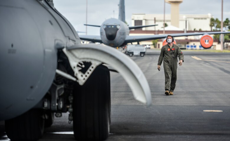 Maj. James Leenman, 535th Airlift Squadron pilot, conducts a preflight inspection on a C-17 Globemaster III during Exercise TROPIC FURY at Joint Base Pearl Harbor-Hickam, Hawaii, March 12, 2021. The 15th Wing prepared to generate and deploy combat power from JBPHH, but is ready to receive, stage and enable onward movement of follow-on forces. (U.S. Air Force photo by Tech. Sgt. Anthony Nelson Jr.)