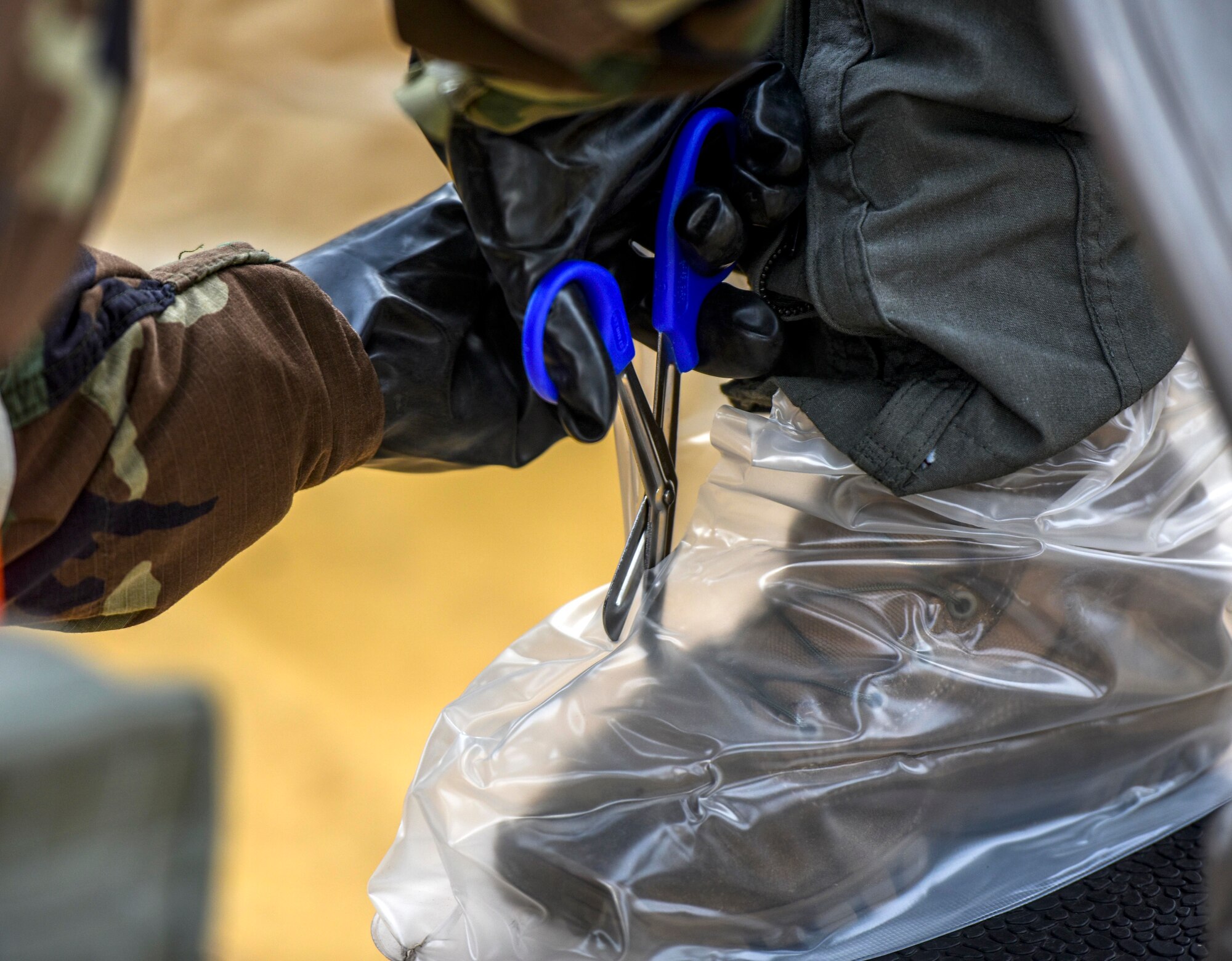 Airman 1st Class Jordan Brown, 535th Airlift Squadron loadmaster, participates in a decontamination process as part of Exercise TROPIC FURY at Joint Base Pearl Harbor-Hickam, Hawaii, March 11, 2021. Exercise TROPIC FURY demonstrated the 15th Wing’s No. 1 priority, ready now, a key to sustaining operations through the COVID-19 pandemic. (U.S. Air Force photo by Tech. Sgt. Anthony Nelson Jr. )