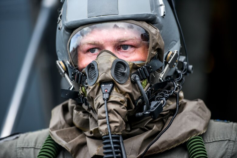Capt. Conner Muilenburg, 535th Airlift Squadron pilot, exits a C-17 Globemaster III during Exercise TROPIC FURY at Joint Base Pearl Harbor-Hickam, Hawaii, March 11, 2021. Exercise TROPIC FURY demonstrated the 15th Wing’s No. 1 priority, ready now, a key to sustaining operations through the COVID-19 pandemic. (U.S. Air Force photo by Tech. Sgt. Anthony Nelson Jr. )