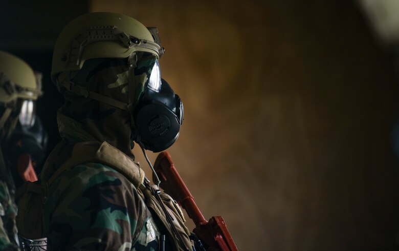 647th Security Forces Airmen find shelter during a simulated attack at Mount Village during Exercise TROPIC FURY at Joint Base Pearl Harbor-Hickam, Hawaii, March 11, 2021. Exercise TROPIC FURY demonstrated the 15th Wing’s No. 1 priority, ready now, a key to sustaining operations through the COVID-19 pandemic. (U.S. Air Force photo by Tech. Sgt. Anthony Nelson Jr. )