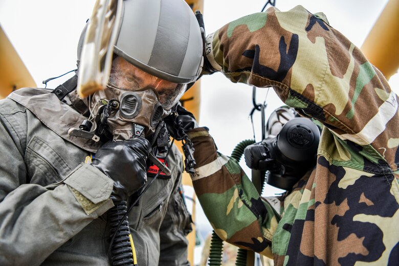 Airman 1st Class Jordan Brown, 535th Airlift Squadron loadmaster, participates in a decontamination process as part of Exercise TROPIC FURY at Joint Base Pearl Harbor-Hickam, Hawaii, March 11, 2021. Exercise TROPIC FURY demonstrated the 15th Wing’s No. 1 priority, ready now, a key to sustaining operations through the COVID-19 pandemic. (U.S. Air Force photo by Tech. Sgt. Anthony Nelson Jr. )