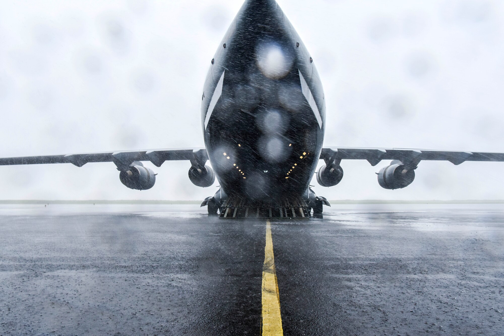 A C-17 Globemaster III is positioned to receive Soldiers with Alpha Battery, 5th Battalion, 3rd Field Artillery Regiment, 17th Field Artillery Brigade during Exercise TROPIC FURY at Pacific Missile Range Facility Barking Sands, Hawaii, March 12, 2021. The C-17 is capable of rapid strategic delivery of troops and all types of cargo to main operating bases or directly to forward bases in the deployment area. (U.S. Air Force photo by Tech. Sgt. Anthony Nelson Jr.)
